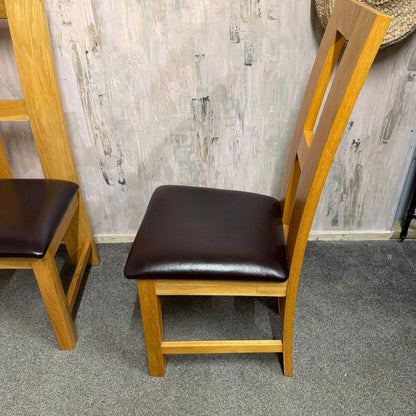 2 Solid Wood Dining Chairs Brown Leather Seats Sturdy Open Design Back