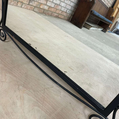 Black metal scroll framed mirror