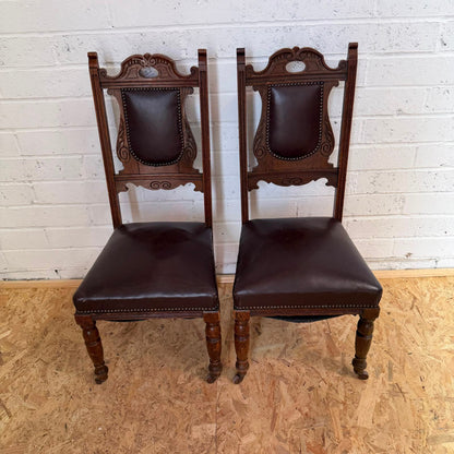Pair Edwardian? Jacobean Style Dining Chairs Leather Seats Carved Backs Castors
