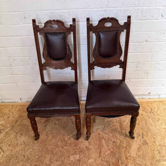 Pair Edwardian? Jacobean Style Dining Chairs Leather Seats Carved Backs Castors