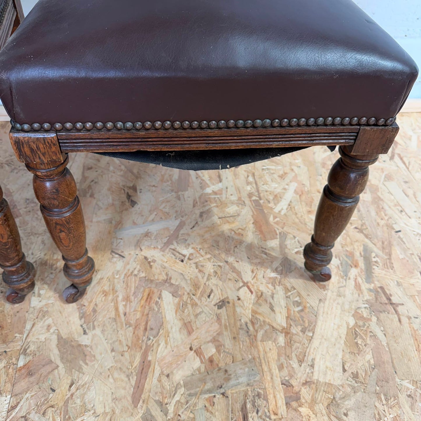 Pair Edwardian? Jacobean Style Dining Chairs Leather Seats Carved Backs Castors