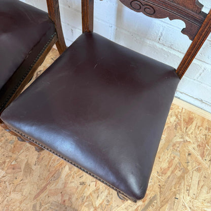 Pair Edwardian? Jacobean Style Dining Chairs Leather Seats Carved Backs Castors