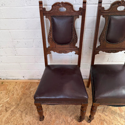Pair Edwardian? Jacobean Style Dining Chairs Leather Seats Carved Backs Castors