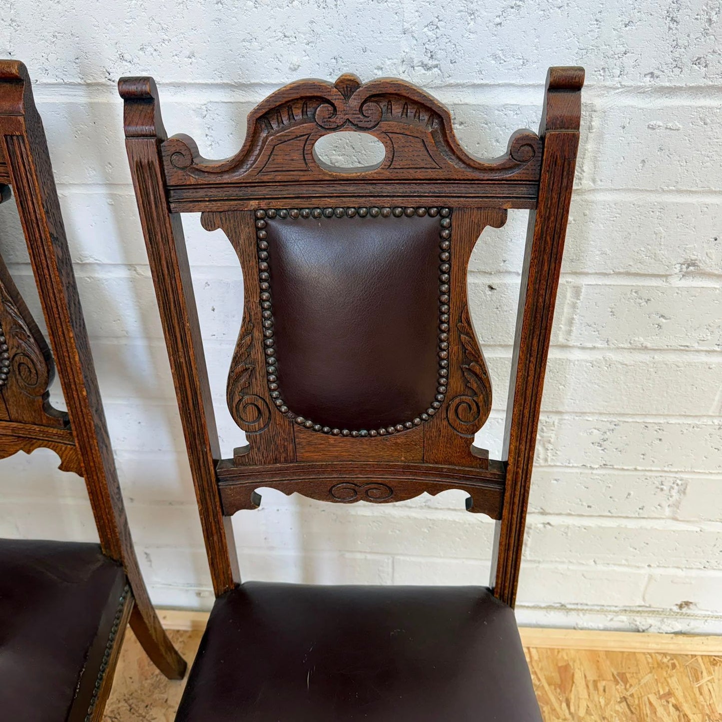 Pair Edwardian? Jacobean Style Dining Chairs Leather Seats Carved Backs Castors