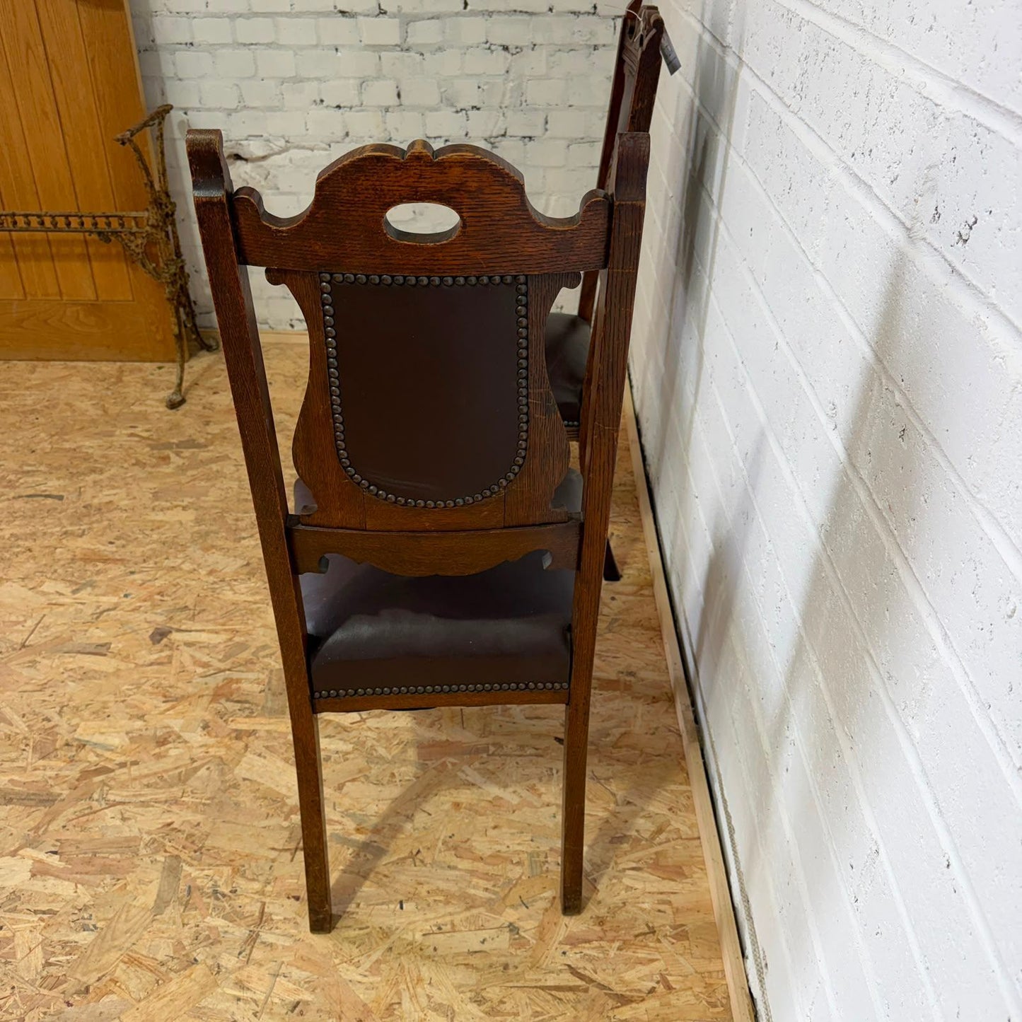 Pair Edwardian? Jacobean Style Dining Chairs Leather Seats Carved Backs Castors