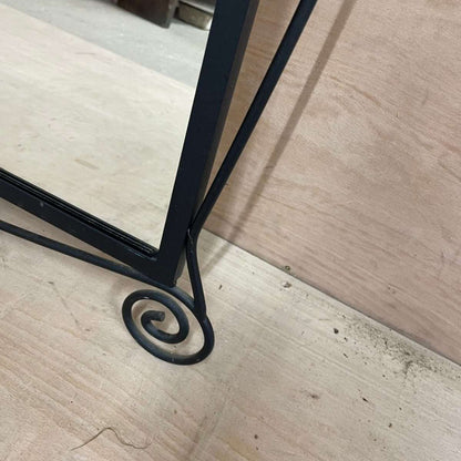 Black metal scroll framed mirror